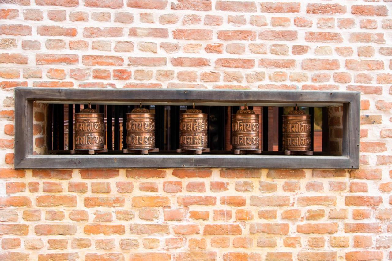 Basera Boutique Hotel Катманду Екстериор снимка Prayer wheels at the temple
